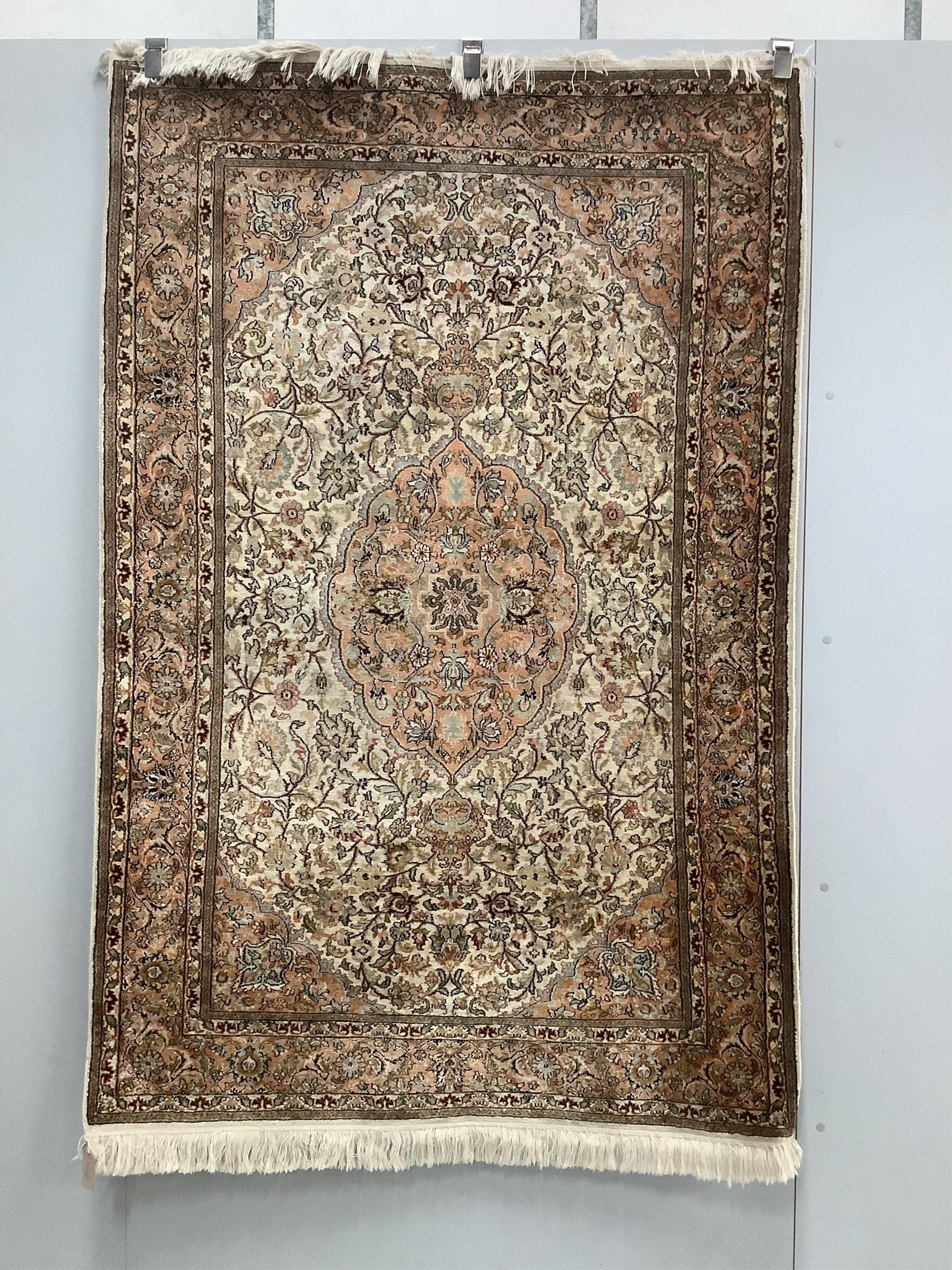 An Indian Persian style cream ground rug, 191 x 122cm. Condition - fair to good